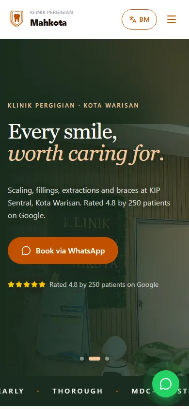 Klinik Pergigian Mahkota website on a phone